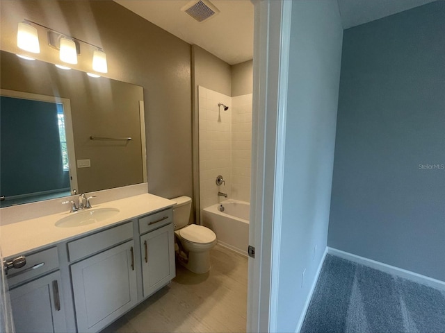 full bathroom with toilet, shower / tub combination, visible vents, and vanity