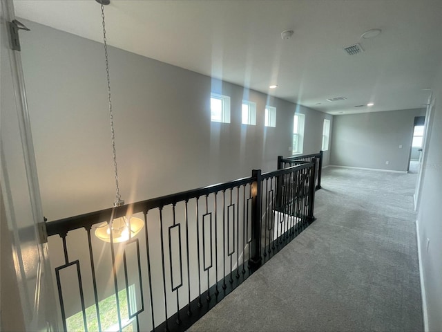 hall featuring recessed lighting, carpet, an upstairs landing, baseboards, and visible vents