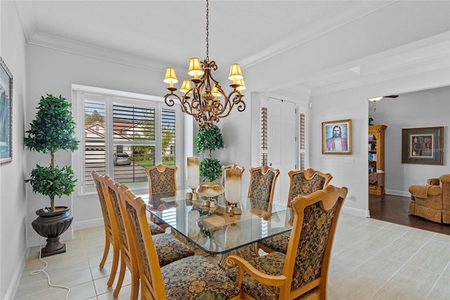 tiled dining space with a chandelier and crown molding