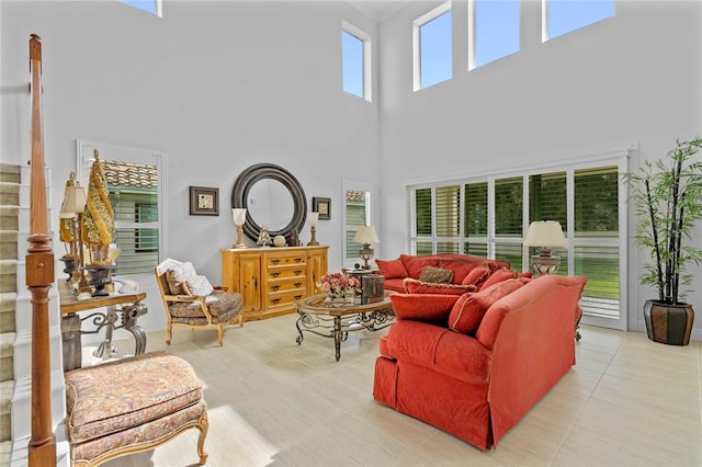 tiled living room with a towering ceiling