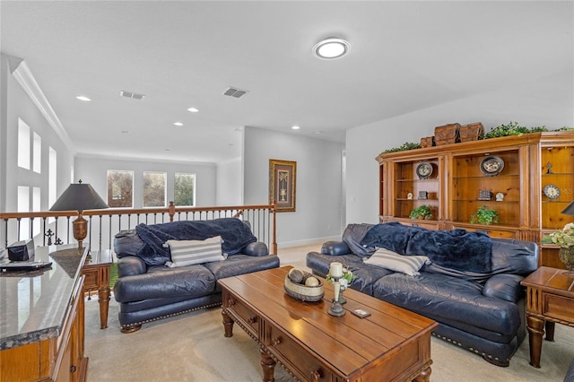 carpeted living room with crown molding