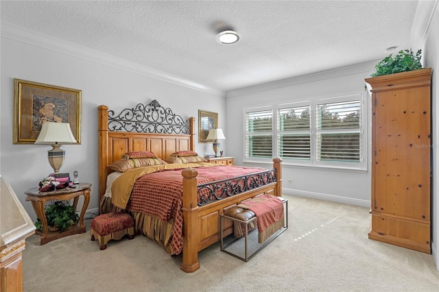 bedroom featuring a textured ceiling, light colored carpet, and crown molding