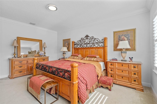 carpeted bedroom with ornamental molding and a textured ceiling