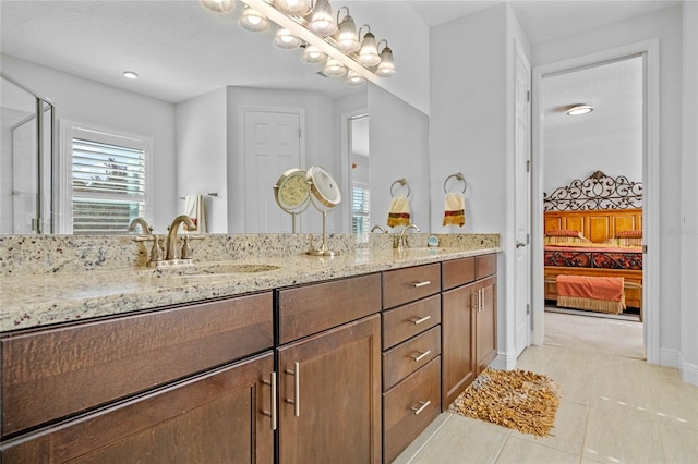 bathroom with vanity, a textured ceiling, and tile patterned floors