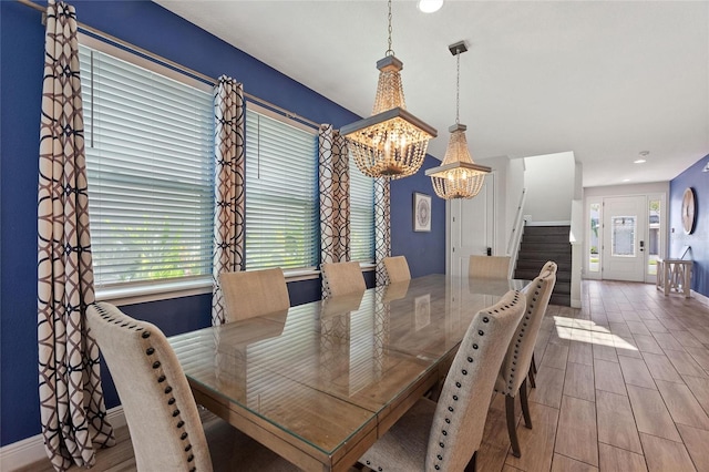 dining room featuring hardwood / wood-style flooring and a chandelier