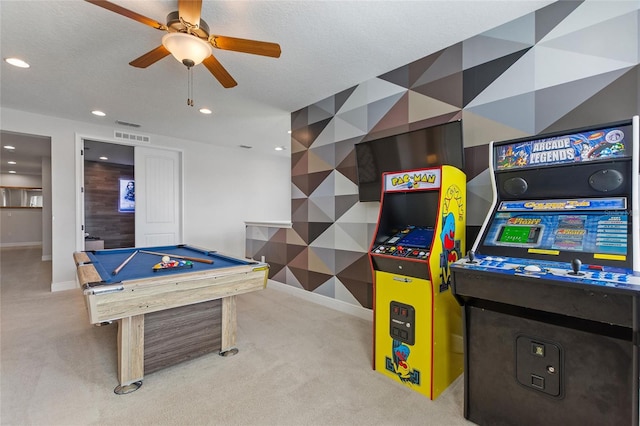 rec room with a textured ceiling, billiards, light carpet, and ceiling fan