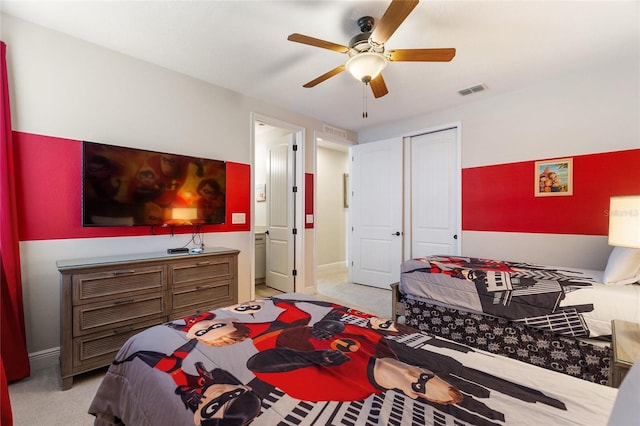 carpeted bedroom featuring a closet and ceiling fan