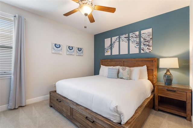 bedroom with light colored carpet and ceiling fan