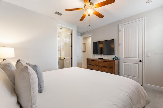 bedroom featuring ceiling fan, connected bathroom, and carpet