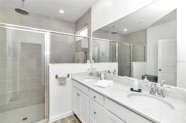 bathroom featuring vanity, wood-type flooring, and a shower with door