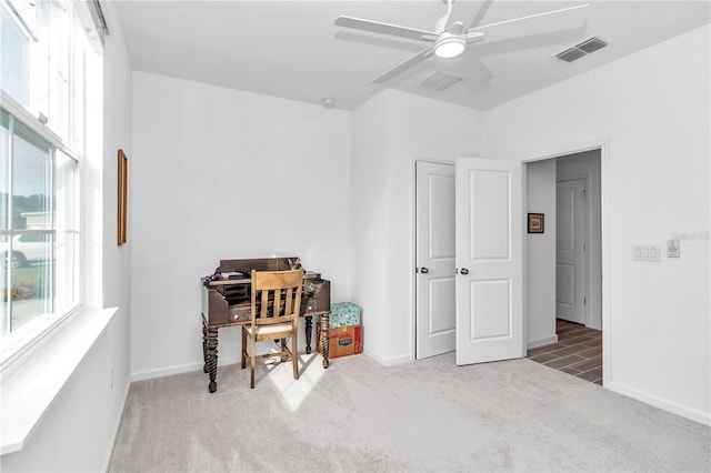 miscellaneous room with carpet flooring, ceiling fan, and a wealth of natural light