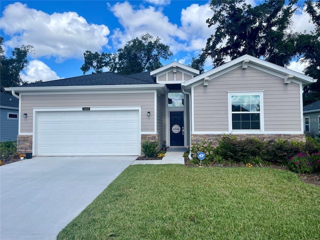 view of front of home with a garage and a front yard