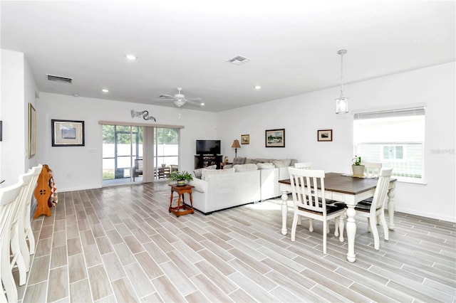 dining space featuring ceiling fan and light hardwood / wood-style floors