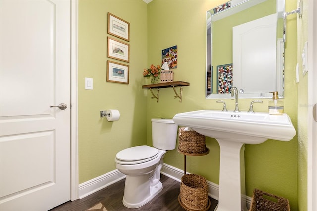 bathroom featuring toilet and hardwood / wood-style floors