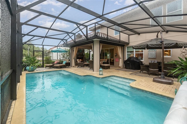 view of pool featuring a patio, area for grilling, glass enclosure, and an outdoor living space