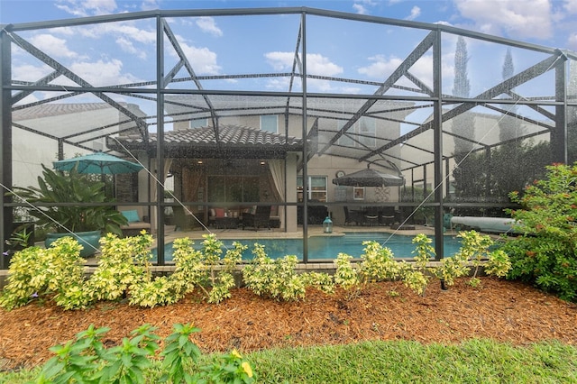 view of swimming pool with a lanai