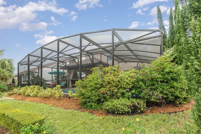 exterior space featuring a lanai and a pool