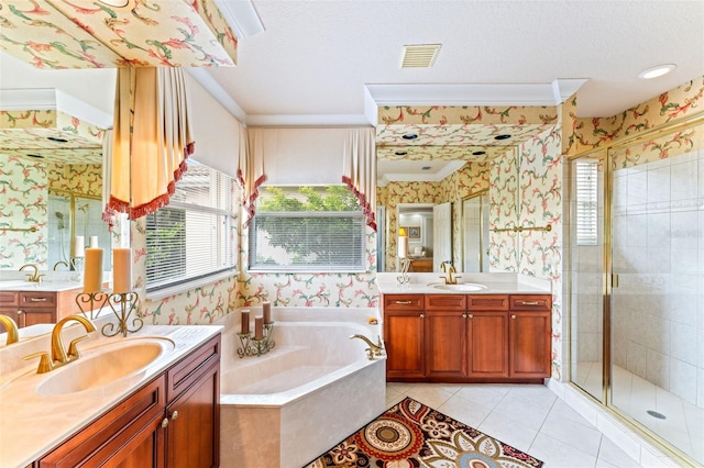 bathroom featuring tile patterned floors, a textured ceiling, ornamental molding, vanity, and plus walk in shower