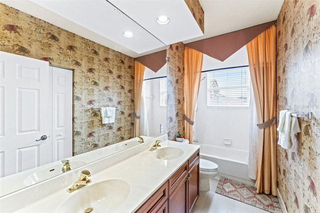 full bathroom featuring tile patterned floors, vanity, toilet, and shower / bath combo