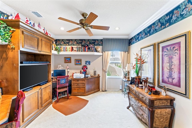 office space featuring ceiling fan, light carpet, and a textured ceiling