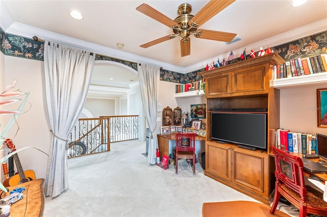 office with light carpet, crown molding, and ceiling fan