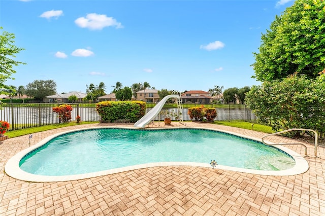 view of swimming pool with a water slide