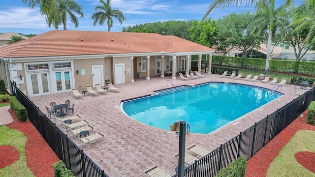 view of swimming pool with a patio