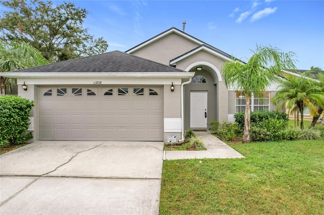 single story home with a garage and a front yard