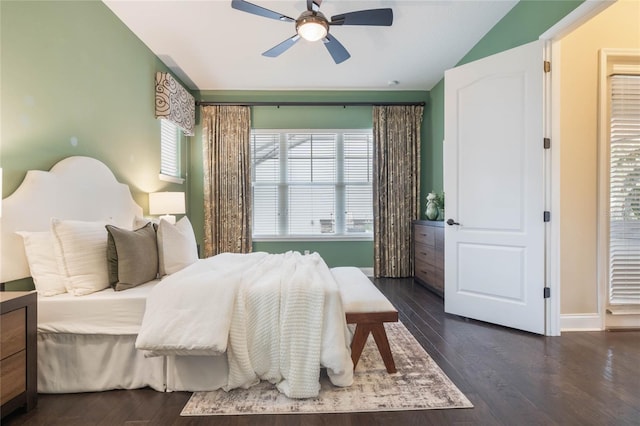 bedroom featuring dark wood-type flooring, ceiling fan, and vaulted ceiling