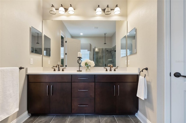 bathroom featuring vanity, tile patterned floors, and a shower with door