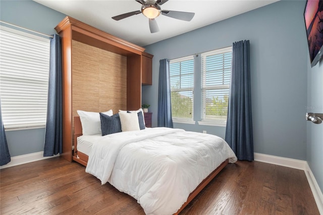 bedroom featuring dark wood-type flooring and ceiling fan