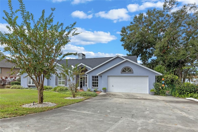 ranch-style house with a front yard and a garage