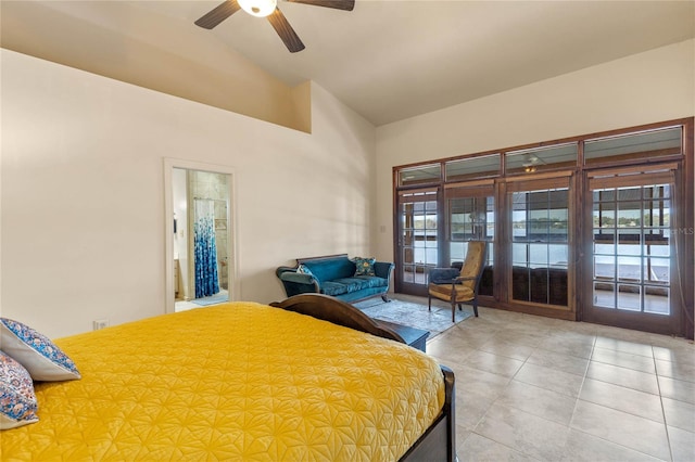 tiled bedroom featuring connected bathroom, access to outside, multiple windows, and ceiling fan