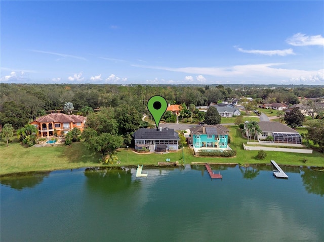 birds eye view of property with a water view