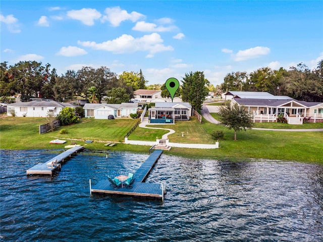 view of dock featuring a water view and a lawn