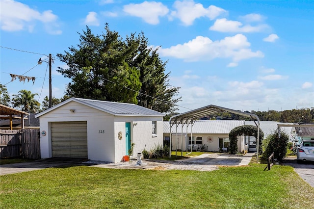 view of front of house featuring a garage and a front lawn