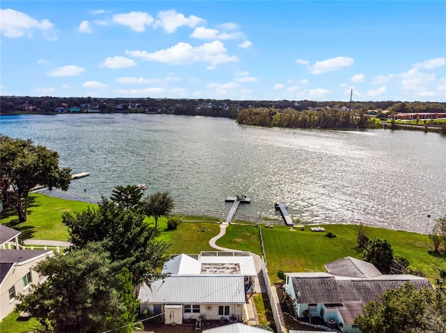 birds eye view of property with a water view