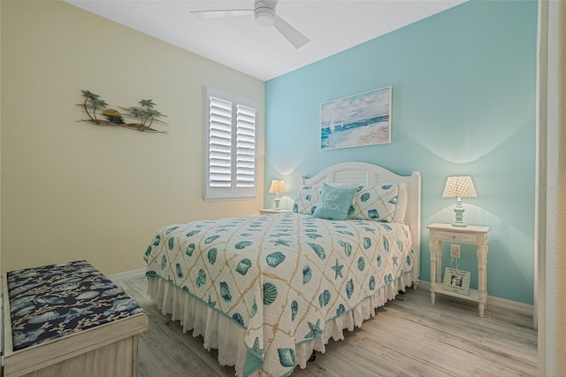 bedroom with hardwood / wood-style flooring and ceiling fan