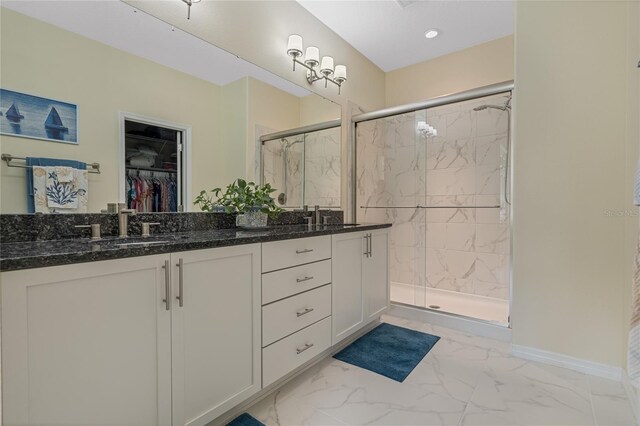 bathroom featuring vanity and an enclosed shower