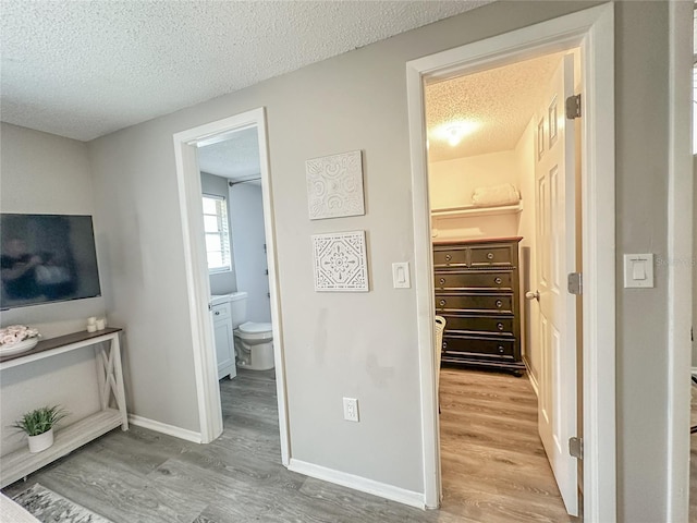 3310 W 63rd St W, Bradenton, FL 34209 - hall with a textured ceiling and wood finished floors