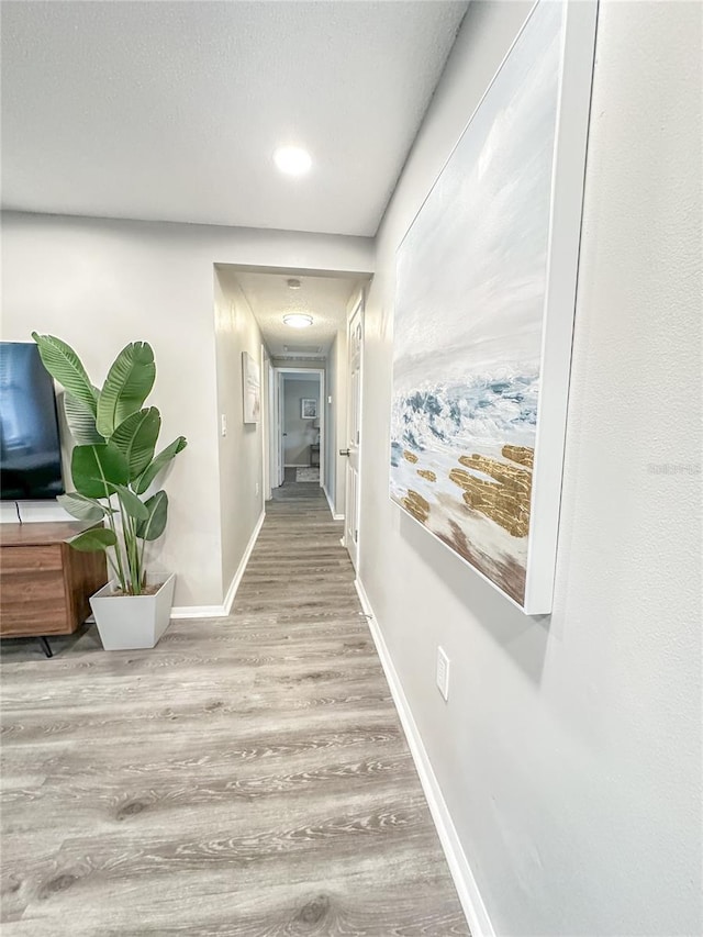 hallway featuring light wood-type flooring