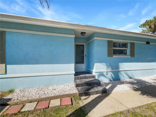 736 Mac Crillus Rd, Largo, FL 33770 - view of exterior entry with stucco siding