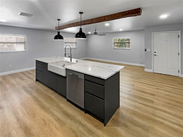 kitchen featuring sink, a large island with sink, stainless steel dishwasher, light hardwood / wood-style flooring, and pendant lighting