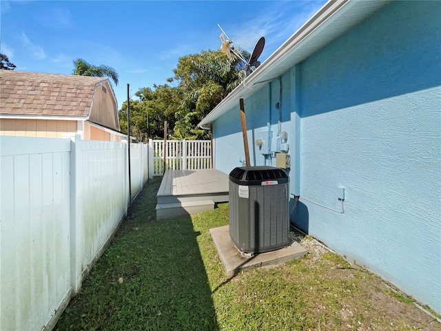 736 Mac Crillus Rd, Largo, FL 33770 - fenced backyard featuring central air condition unit and a deck