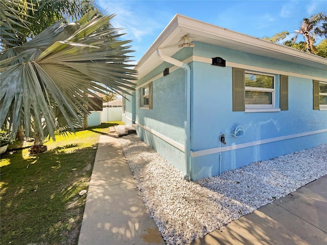 736 Mac Crillus Rd, Largo, FL 33770 - view of side of home with fence and stucco siding