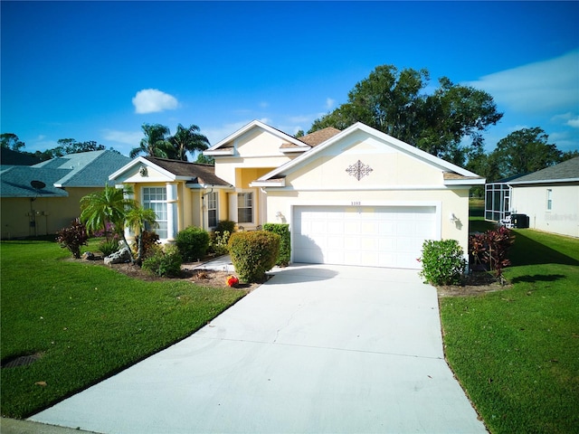 view of front of property featuring a garage and a front lawn