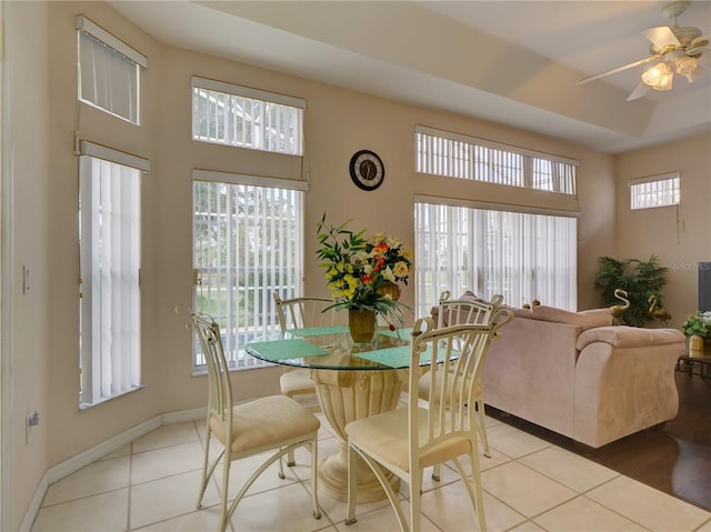 dining room featuring light tile patterned floors and ceiling fan