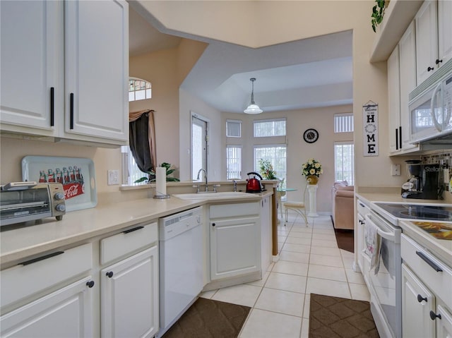 kitchen with pendant lighting, white cabinetry, and white appliances