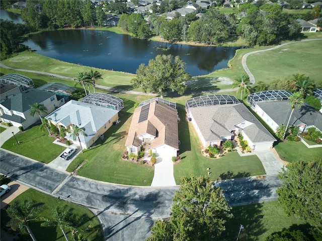 birds eye view of property with a water view