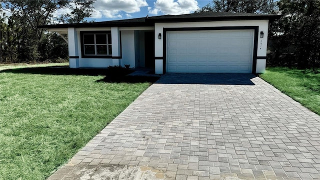 view of front of house featuring a garage and a front yard